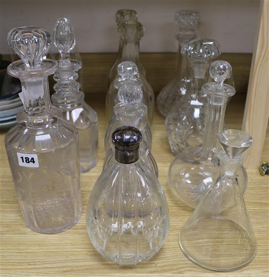 Eleven various cut glass decanters